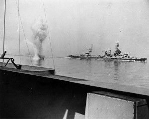 A heavy German coast artillery shell falls between USS Texas and USS Arkansas while the two battleships engage the German battery in Battle of Cherbourg just as William described.